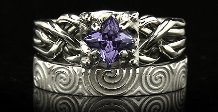 Celtic-inspired tanzanite puzzle engagement ring with Celtic Newgrange spirals band