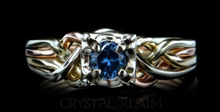 4 band puzzle ring with round lab created blue zircon and bands of four colors 14k gold