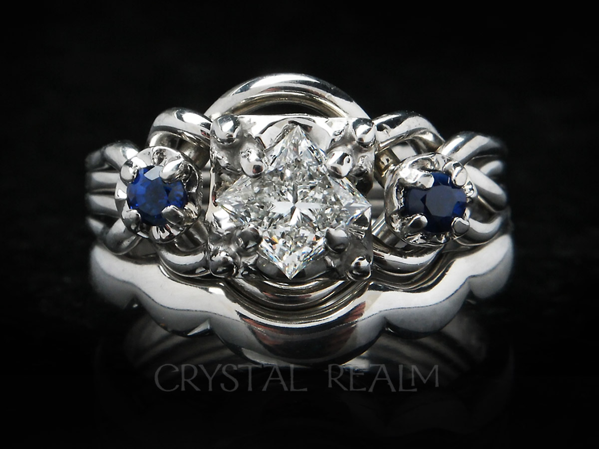 guinevere royale puzzle engagement ring with center diamond and sapphire accents with shadow band