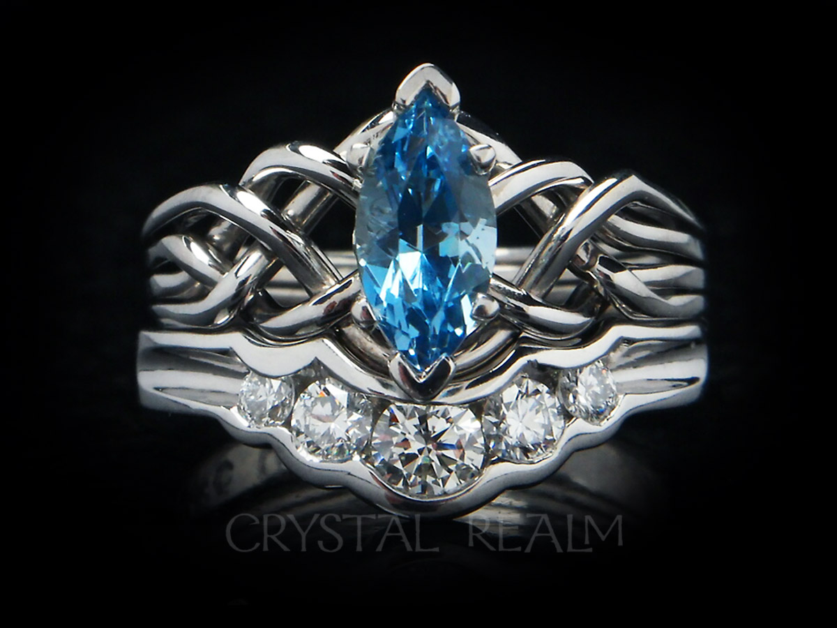 Four band puzzle ring with marquise aquamarine paired with a 5-diamond shadow band