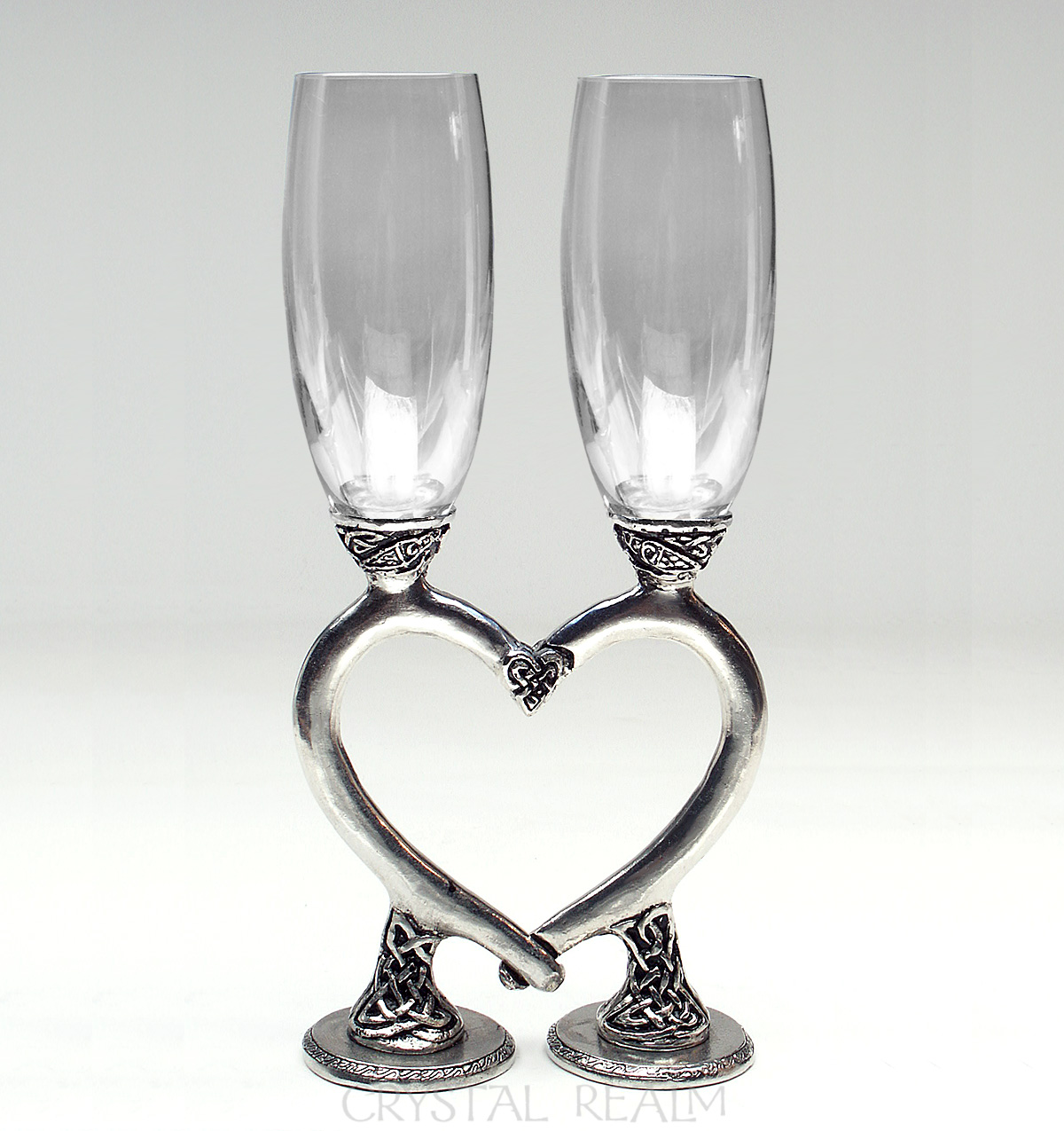 Clear toasting flutes with Celtic heart stems
