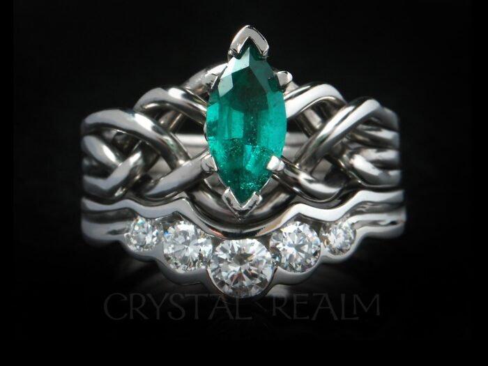 emerald puzzle ring with five diamond shadow band