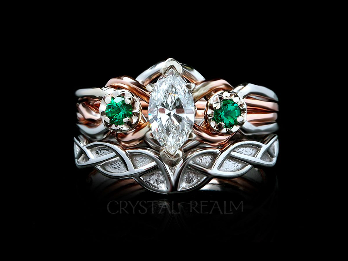 engagement ring with marquise diamond and accent tsavorite garnets with a celtic knotwork wedding band