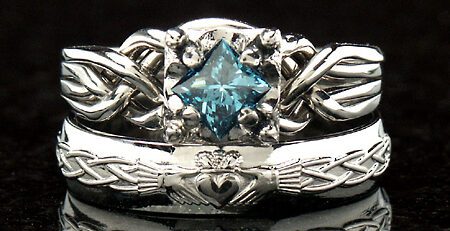 handwoven 4 piece puzzle ring with a one half carat princess blue diamond and a celtic claddagh wedding band
