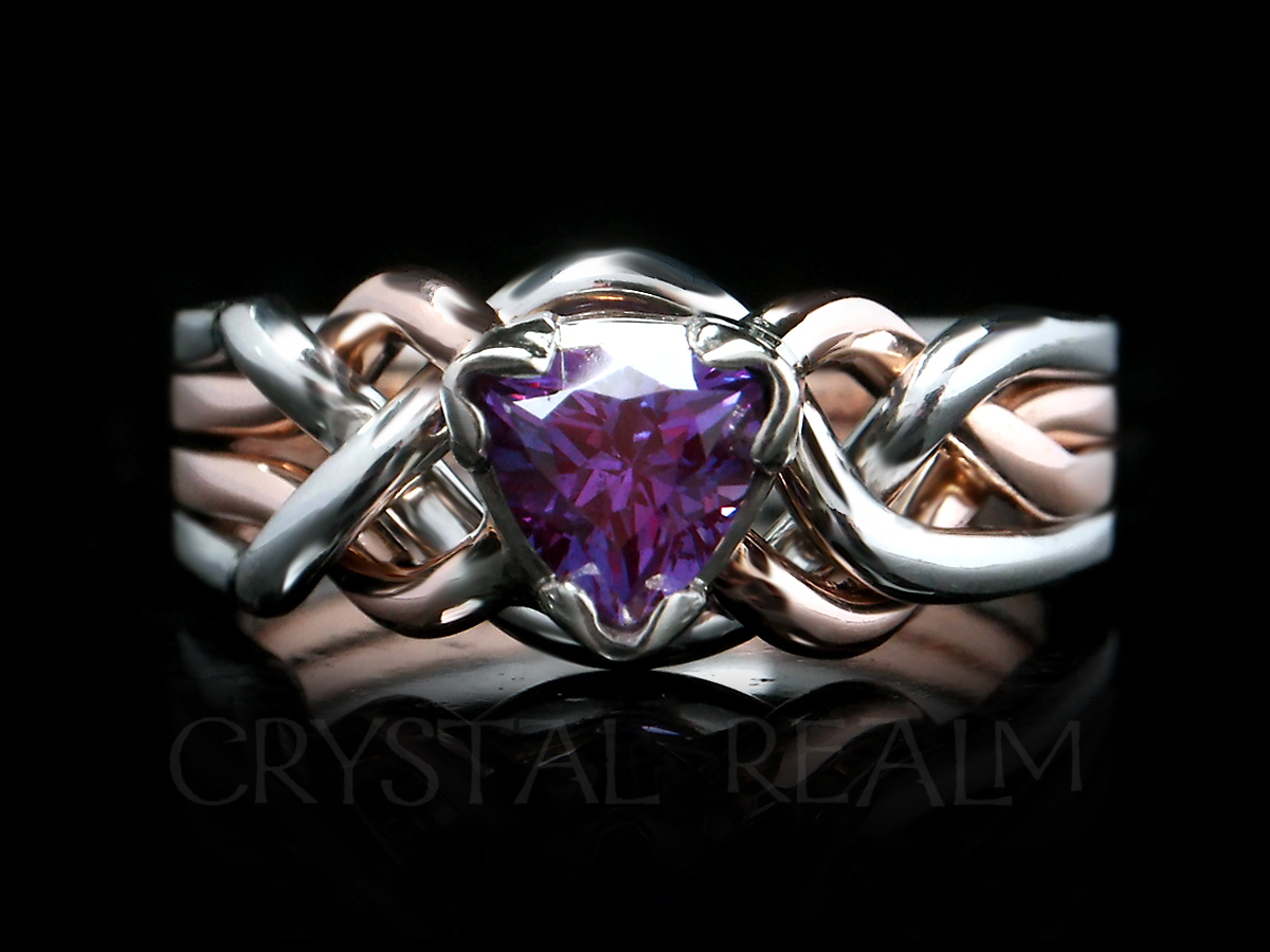 A trillion-cut, lab-created alexandrite graces a 14K rose gold and platinum puzzle ring.