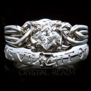Guinevere puzzle ring with custom "amor vincit omnia" shadow band